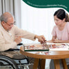 senior doing birdfeeder jigsaw puzzle with dementia nurse