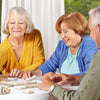 seniors playing colorful dominoes game for dementia patients