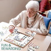 senior playing fun dominoes game for dementia patients