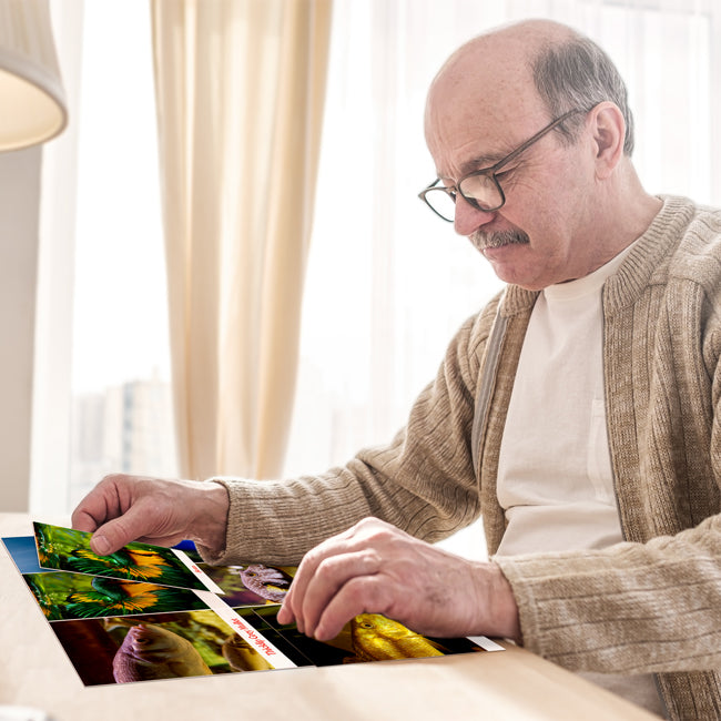 Senior playing match the photo game for dementia patients