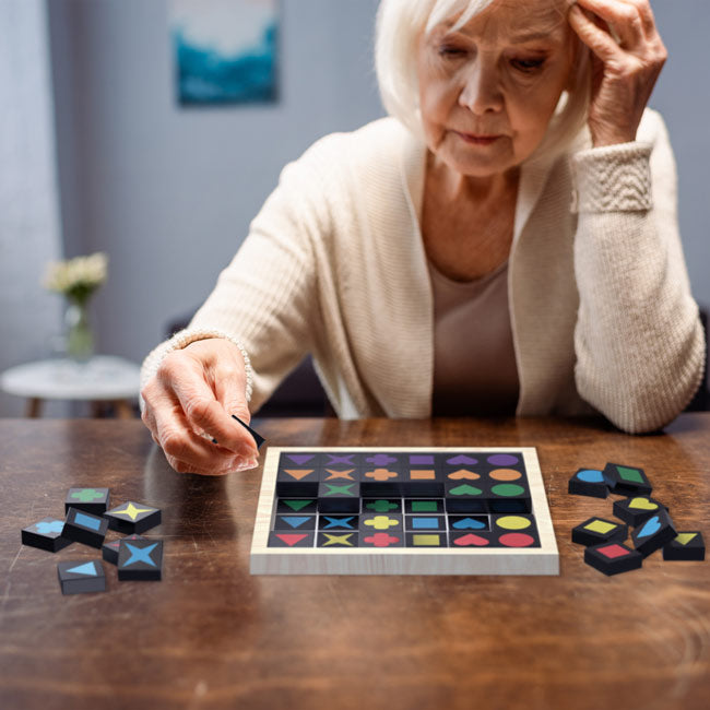 Elderly Woman Playing Match the Shapes Brain Game for Older Adults