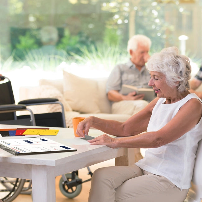 elderly women doing simplified origami for seniors with dementia
