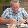 Senior doing Travel Jigsaw Puzzle