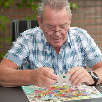 senior doing cartoon states puzzles games
