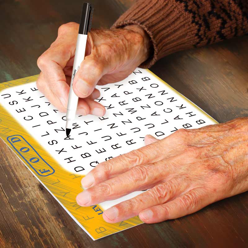 Senior doing Word Search Dementia Puzzles