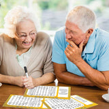 Elderly couple completing word search dementia puzzles